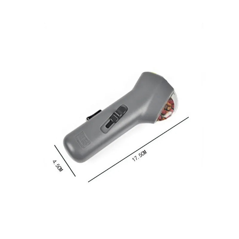 Grey pet snack catapult launcher with spring trigger for dogs and cats