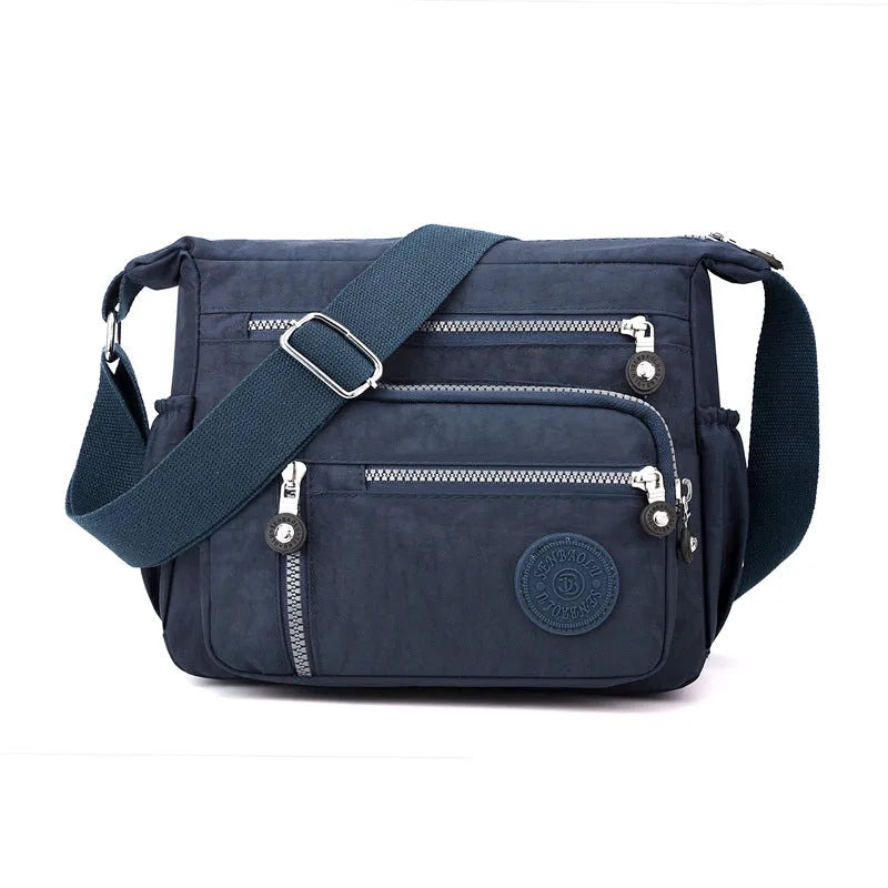 Nylon messenger bag with single shoulder strap in square vertical shape