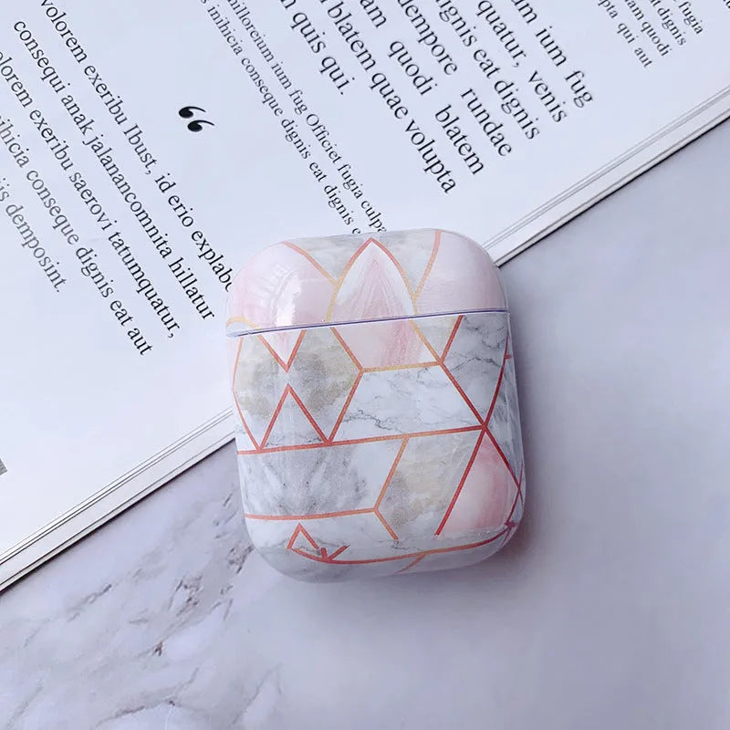 White marble pattern hard case covering an Apple AirPods charging box.