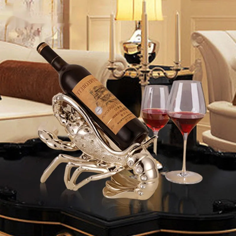 Lobster wine rack ornament in metallic finish displaying bottles