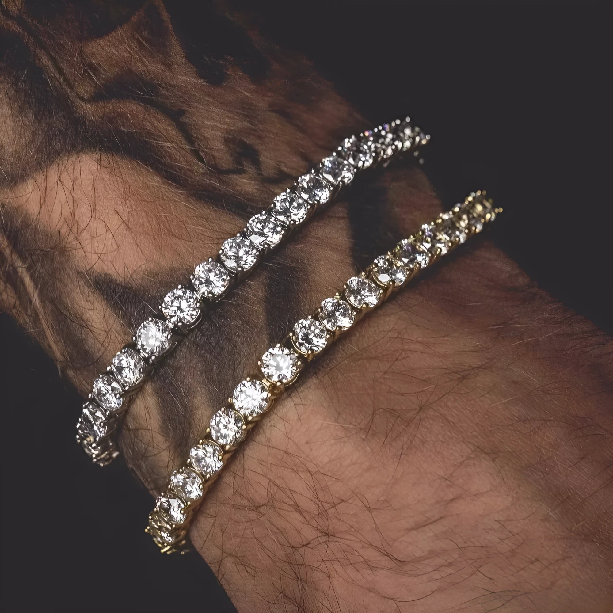Men's silver geometric link bracelet with a single row of blue rhinestones in an iced-out tennis chain design.
