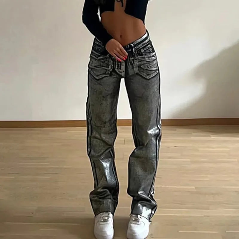 Washed blue high waist straight leg women's jeans on a neutral background.