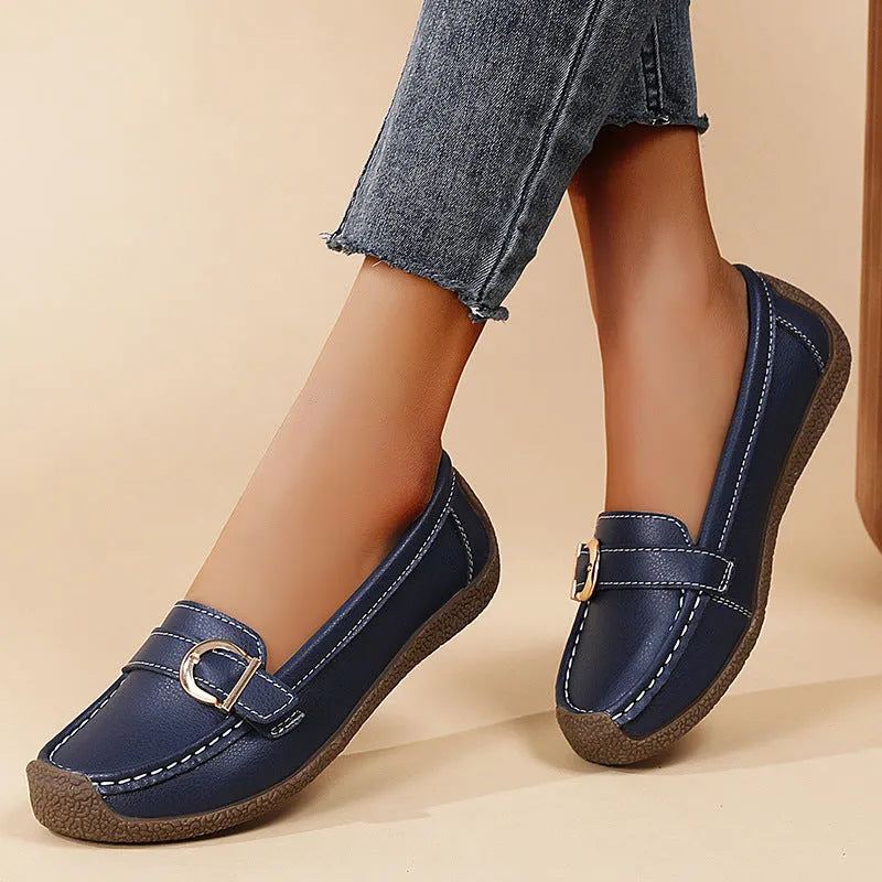 Women's casual loafers in beige with round toe, flat heel, and shallow cut opening.