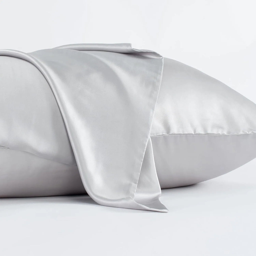 Dark grey envelope-style silk pillowcase laid flat, showing its size and solid colour.