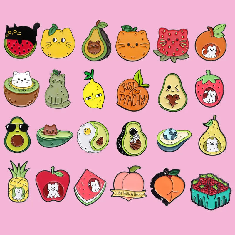 Colourful cartoon fruit and letter design metal brooch pin on a solid background.