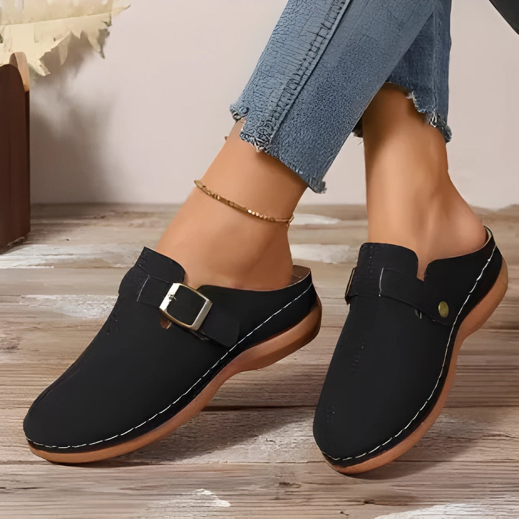 Women's casual wedge slippers in light brown with cloth upper and rubber sole, shown on a foot.