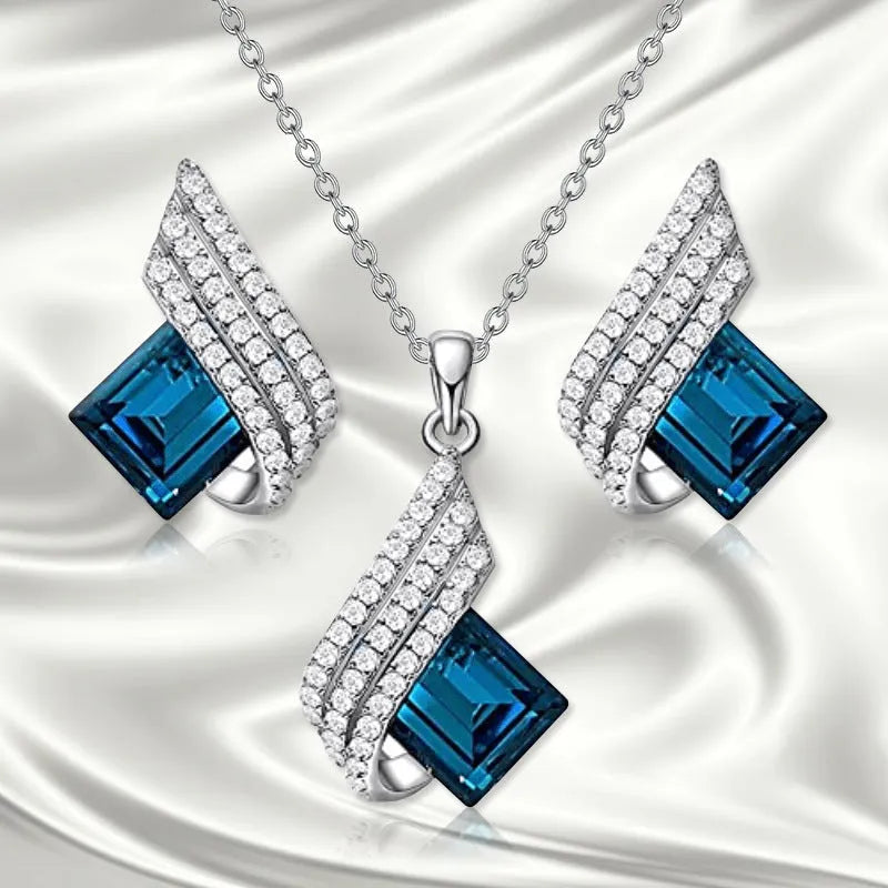 Glass and alloy necklace and earring set with cross chain design and electroplated metallic finish