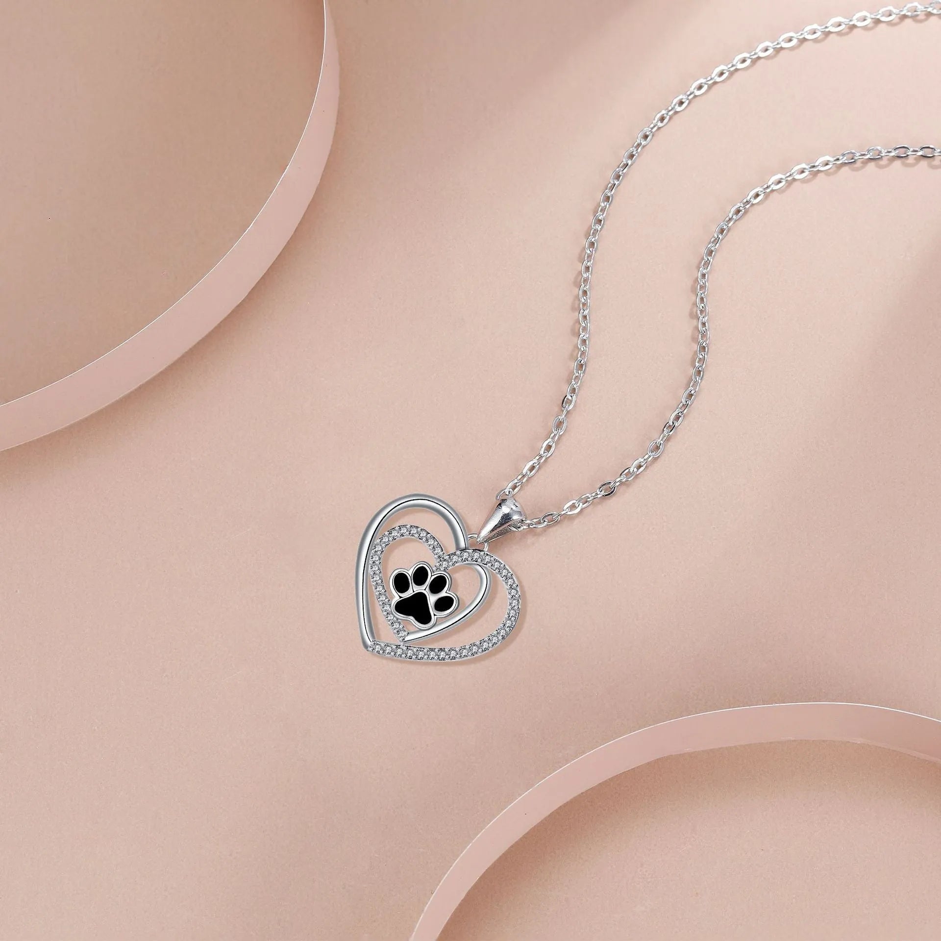 Gold colour dog paw print and heart necklace on cross chain for women