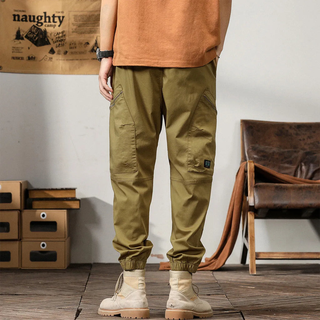 Men's loose fit khaki harem pants with ankle band and zip fly, made from non-ironing cotton fabric.