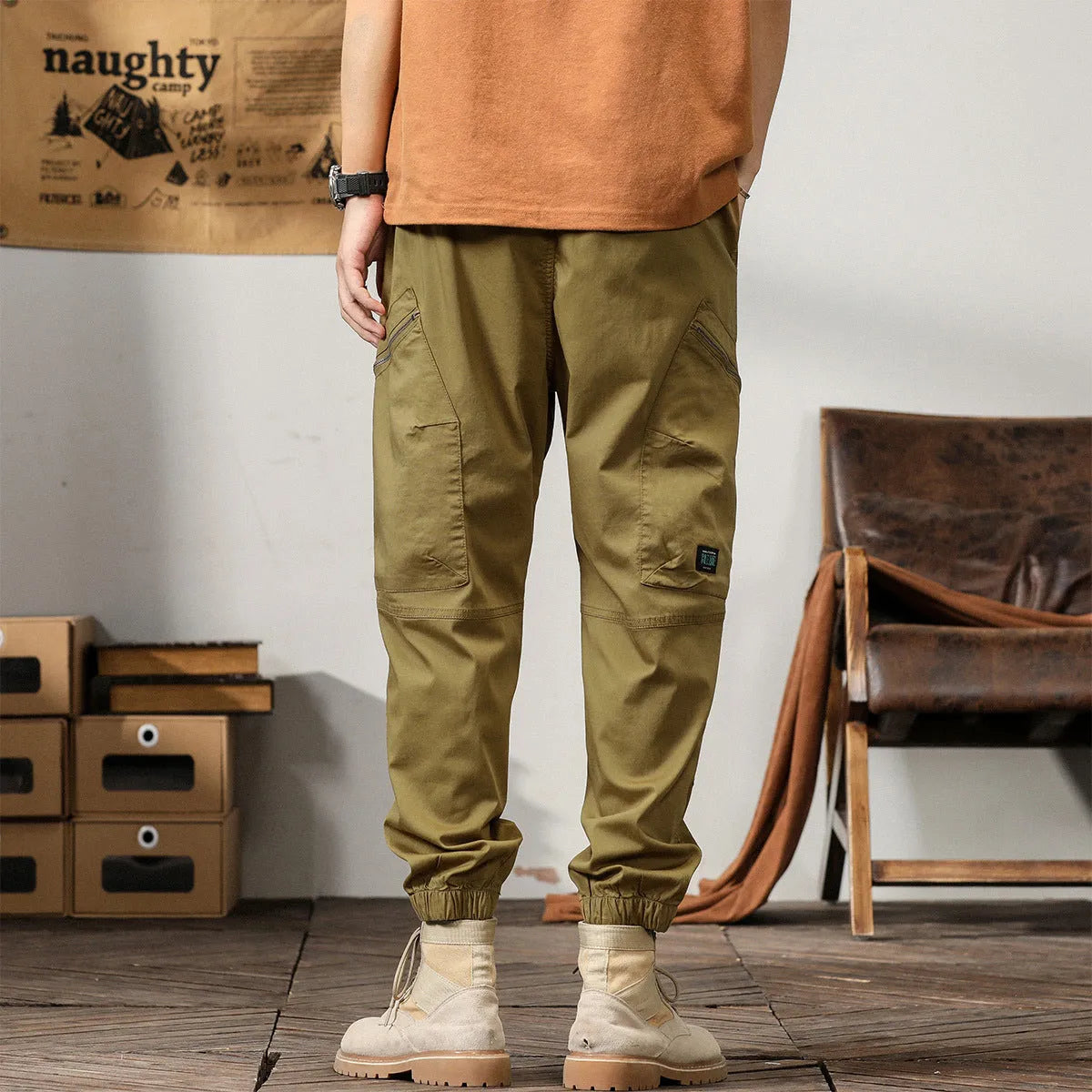 Men's loose fit khaki harem pants with ankle band and zip fly, made from non-ironing cotton fabric.