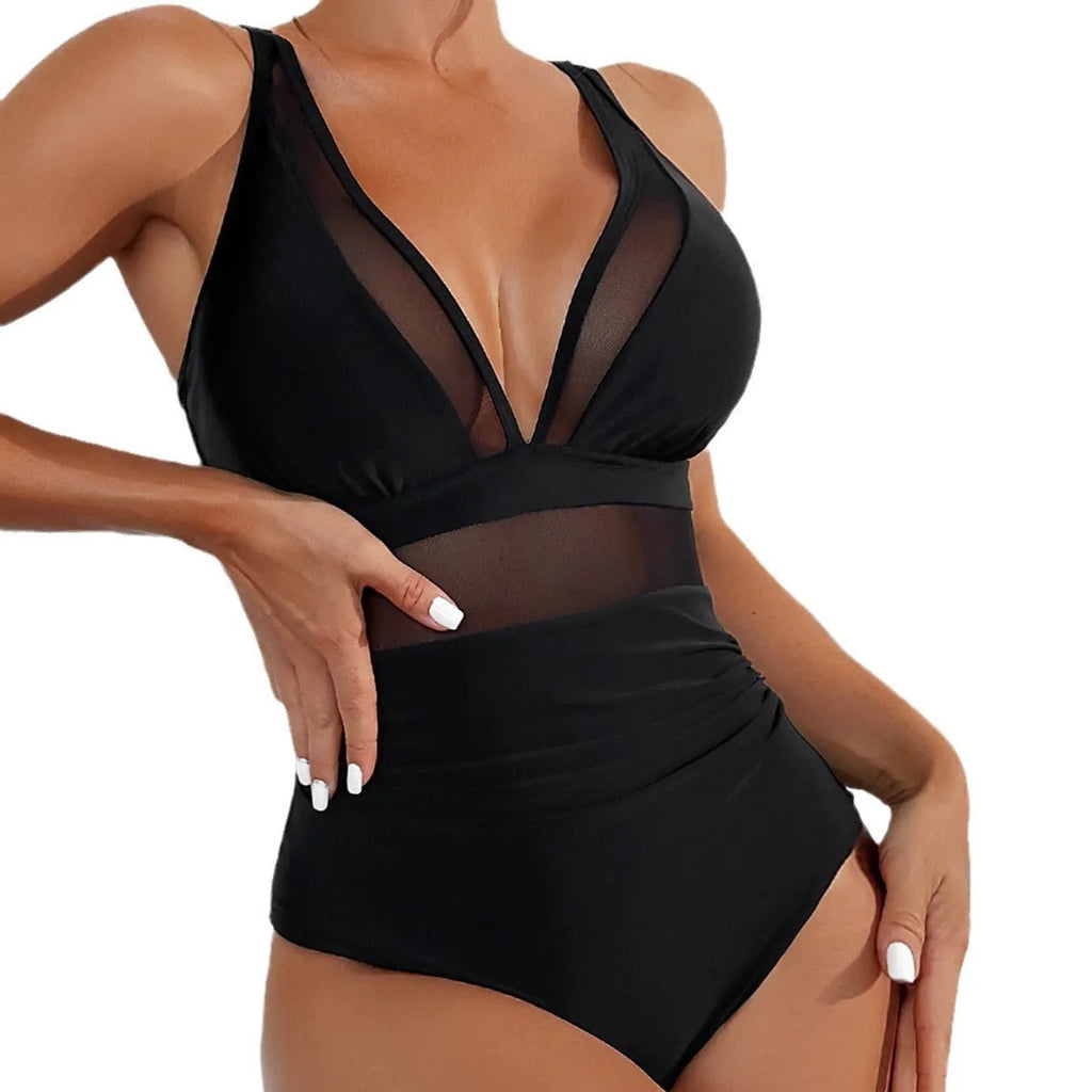 Black women's one-piece halter swimsuit with mesh detailing and brief-style bottom.