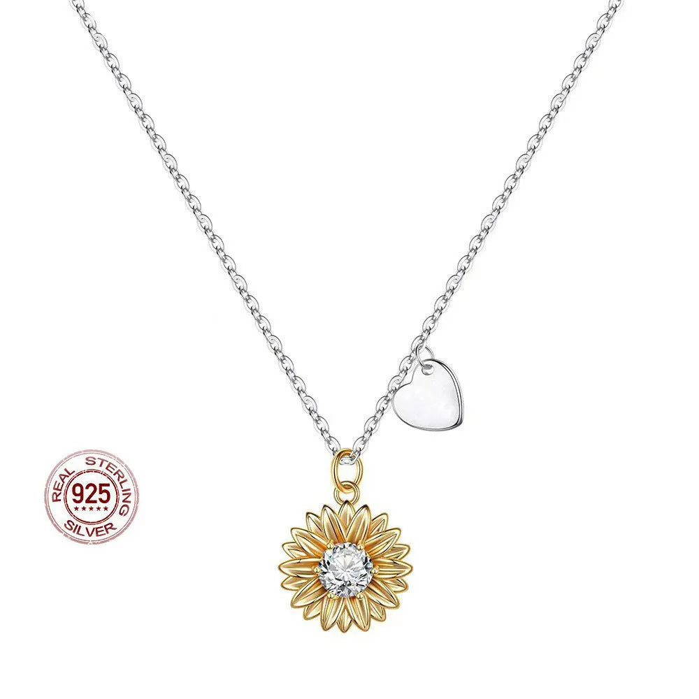 Women's sterling silver sunflower necklace with geometric pendant and adjustable cross chain.