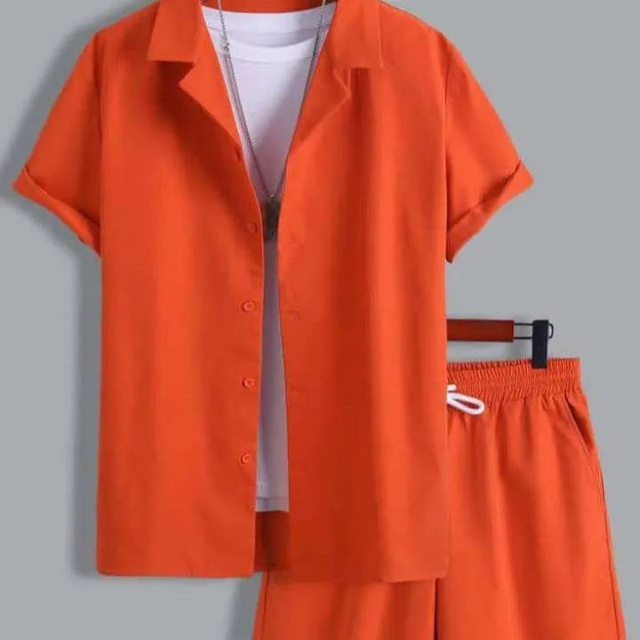Man wearing a short sleeve white Cuban collar shirt and matching shorts from a lightweight polyester sport suit set.