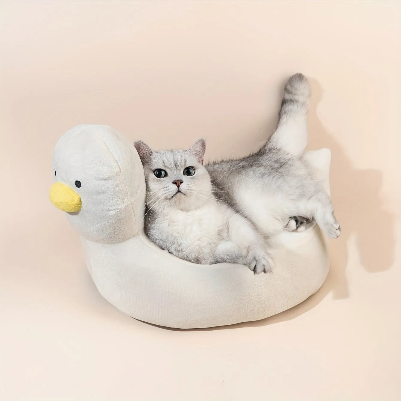 Blue duck-shaped fluffy pet bed sofa for small dogs and cats on floor