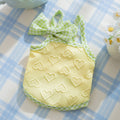 Small dog wearing heart bow vest with elastic suspenders in Bondi Blue colour