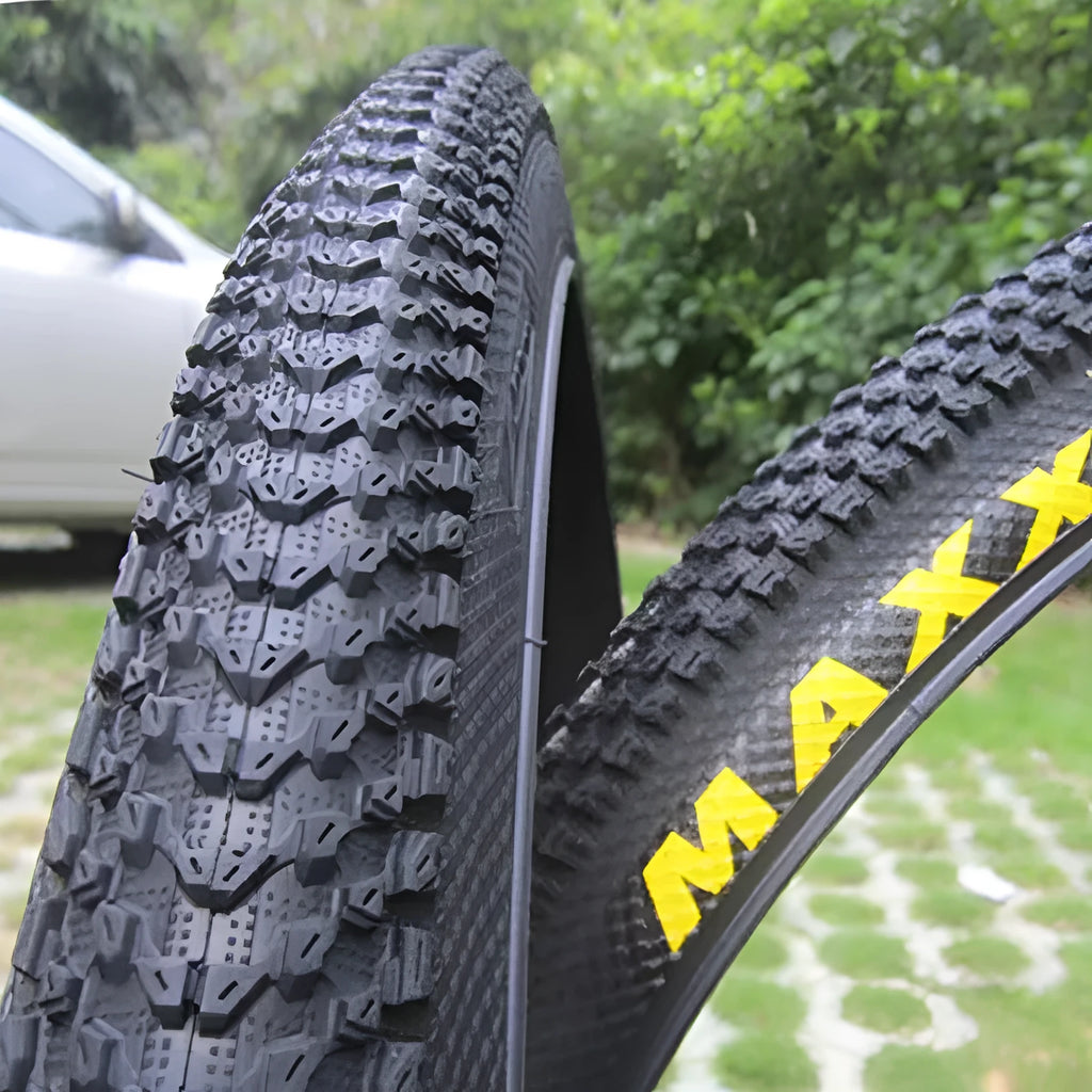 Ultralight puncture-proof mountain bike tyre showing tread pattern and available size options