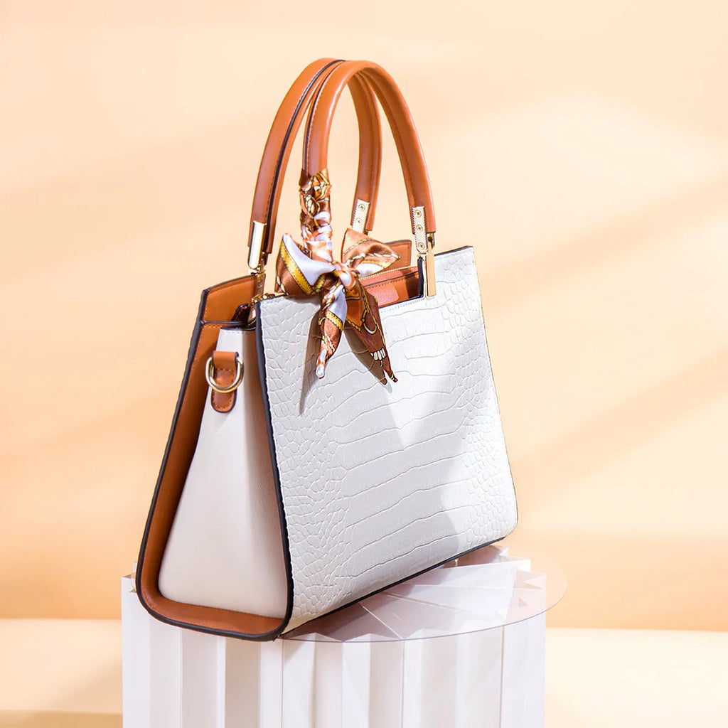 Milky white women's large-capacity PU shoulder handbag with internal organisers and slit pocket.