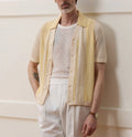 Yellow casual polo shirt with hollow-out pattern and asymmetric design detail, short sleeves