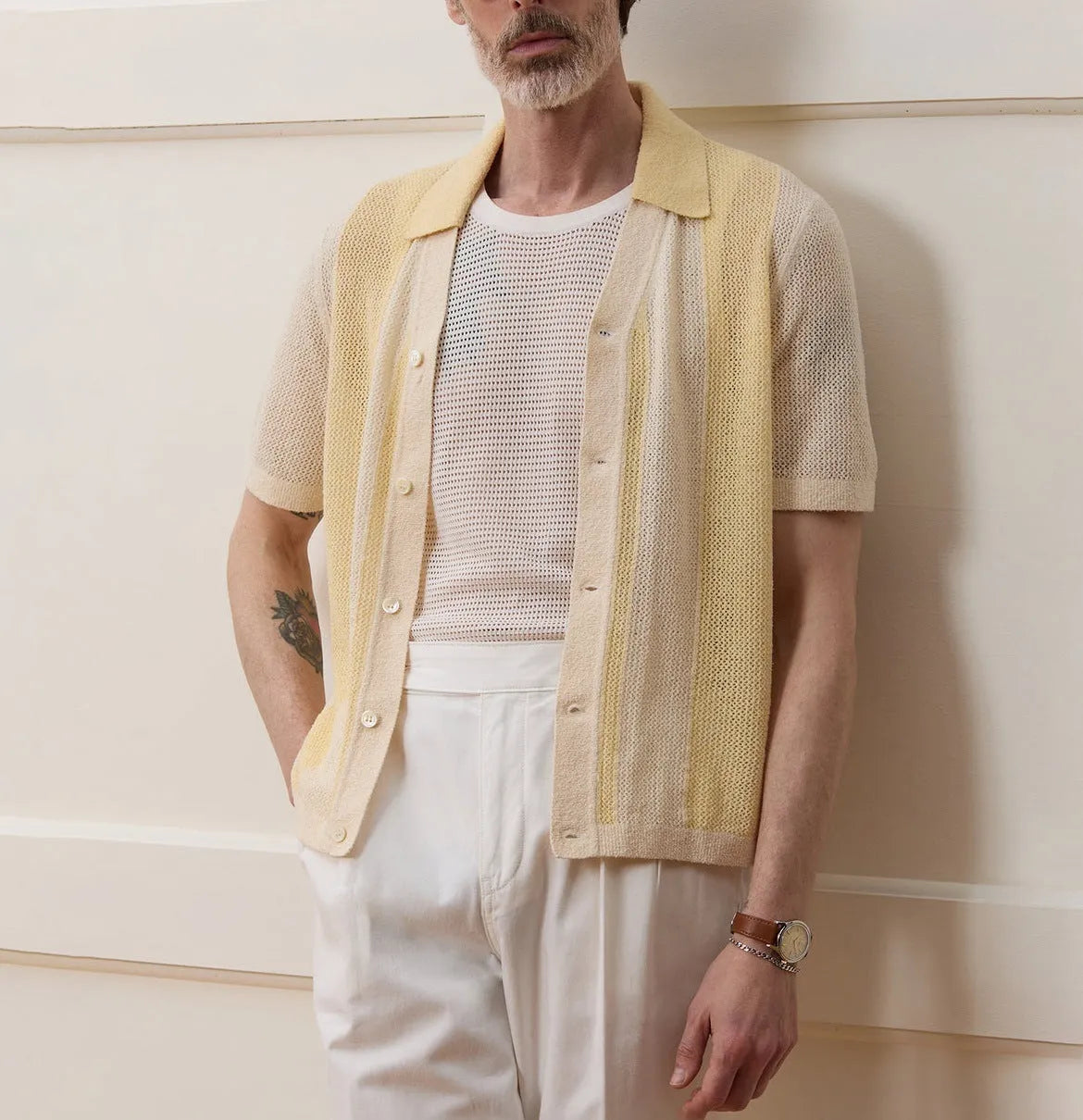 Yellow casual polo shirt with hollow-out pattern and asymmetric design detail, short sleeves