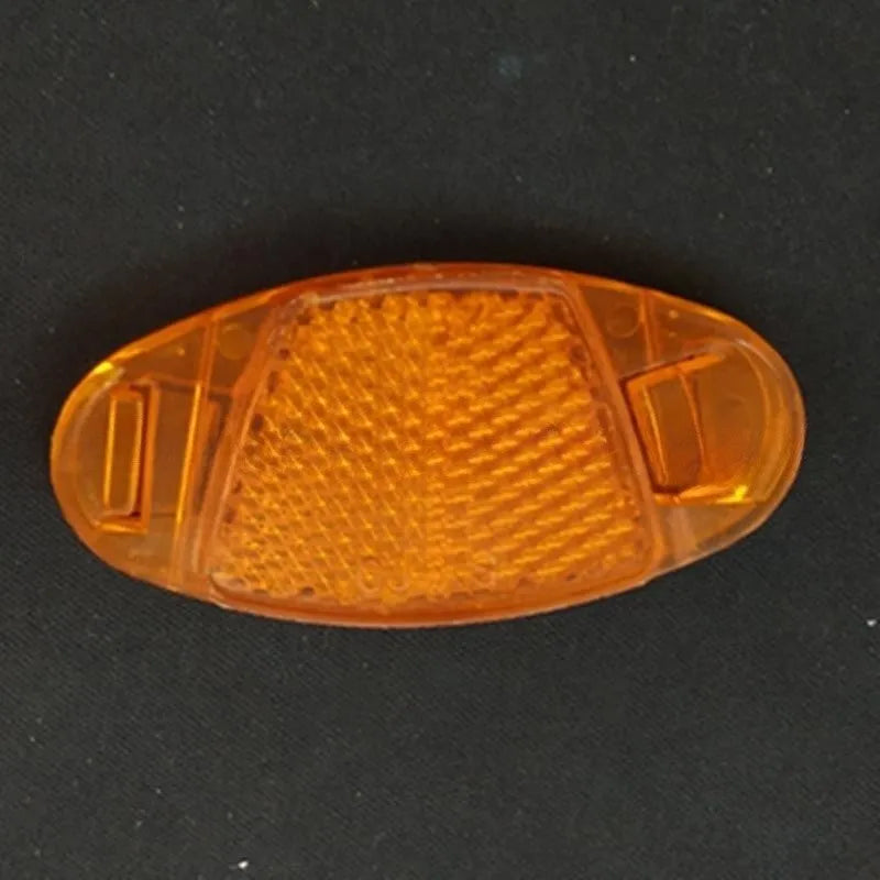 White and yellow bicycle spoke reflectors with plastic construction and night warning film