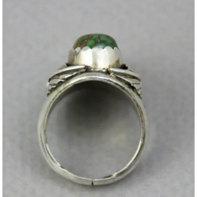 Women's geometric turquoise alloy ring with electroplated finish shown on finger