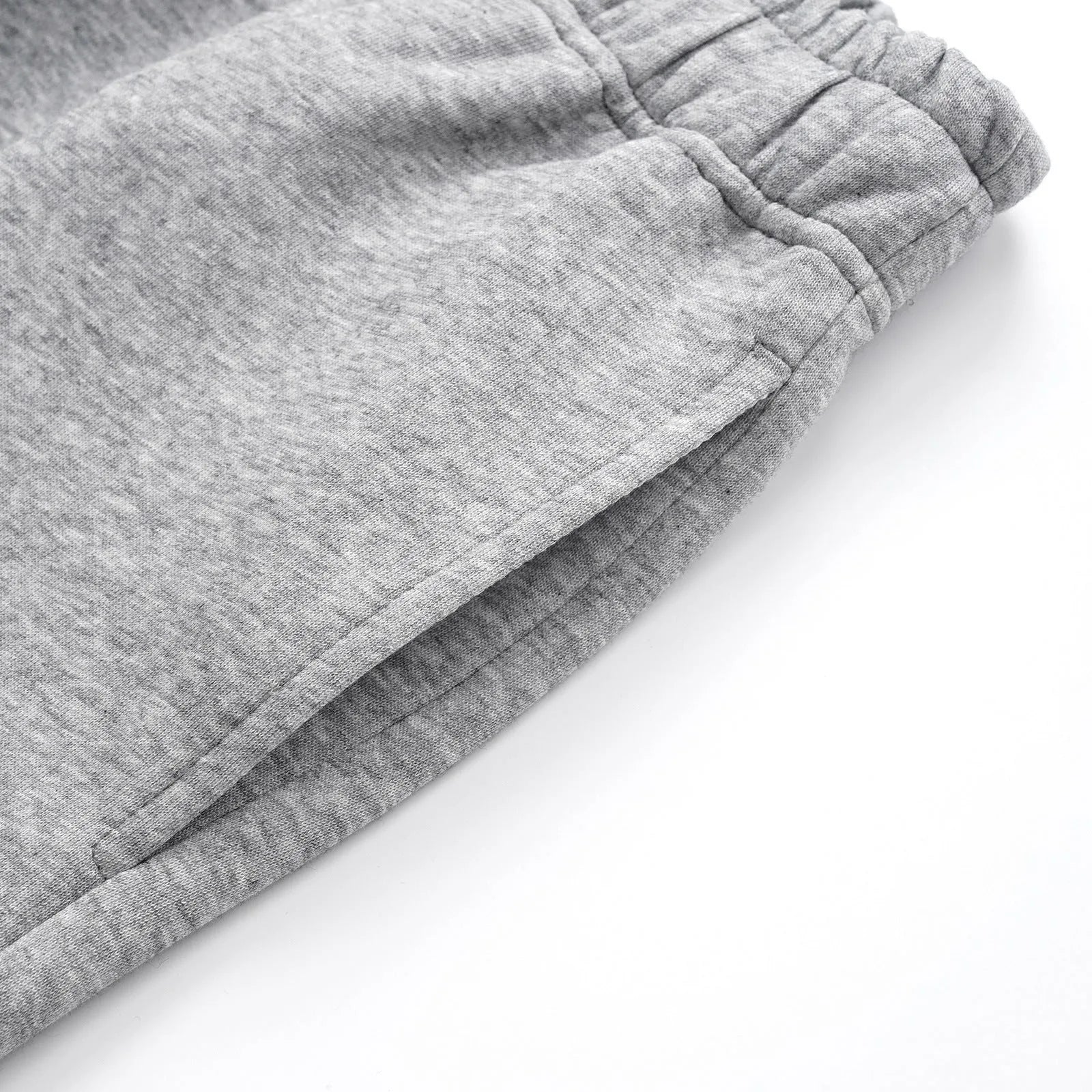 Men's straight-leg cotton casual trousers in grey and black, laid flat showing mid-rise waist and straight leg cut.