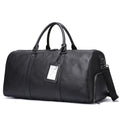 Men's black leather excursion bag with single strap, shown next to coffee colour version