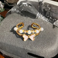 Adjustable copper ring with vintage oil dripping finish showing gourd, flower and bow design with inlaid zircon stones.