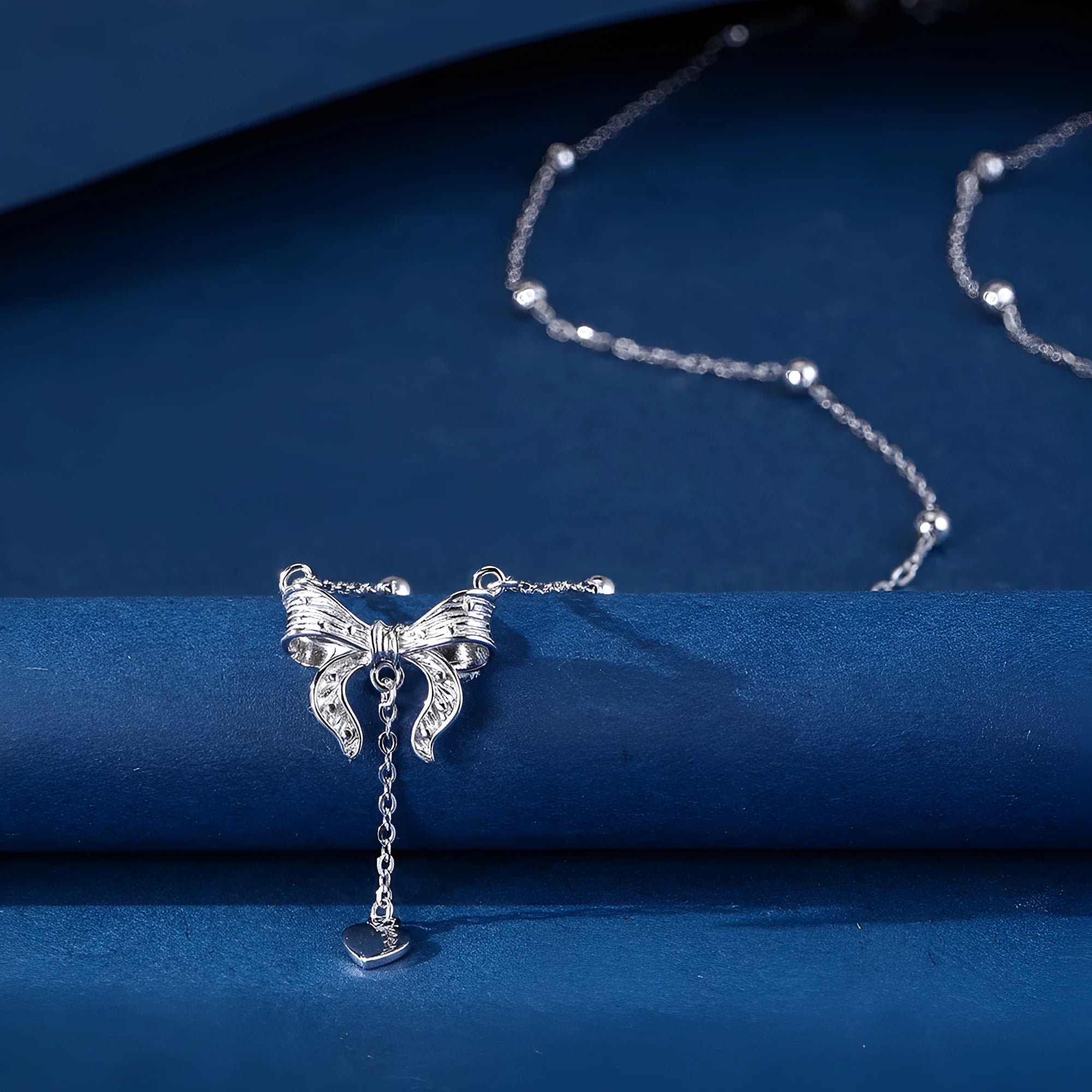 S925 pure silver butterfly and heart-shaped pendant on a silver O-ring clavicle chain.