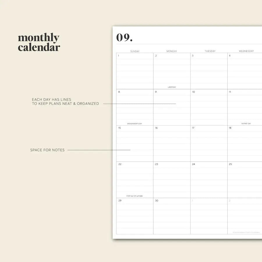 Cherry red coil-bound daily schedule notebook with wire-o binding lying open on surface