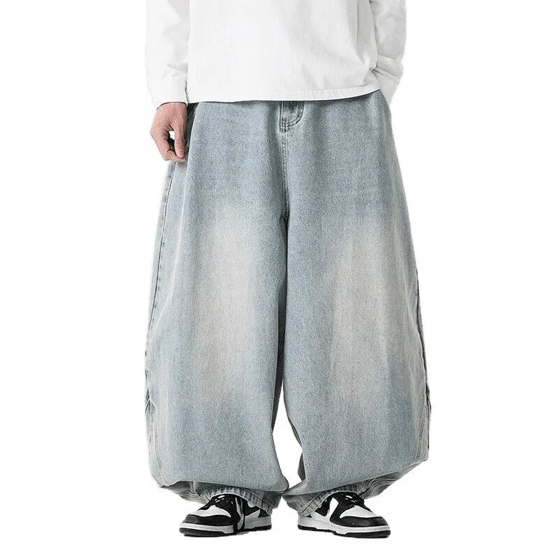 Men's loose fit plus size jeans in dark blue denim showing wide leg and low waist style.