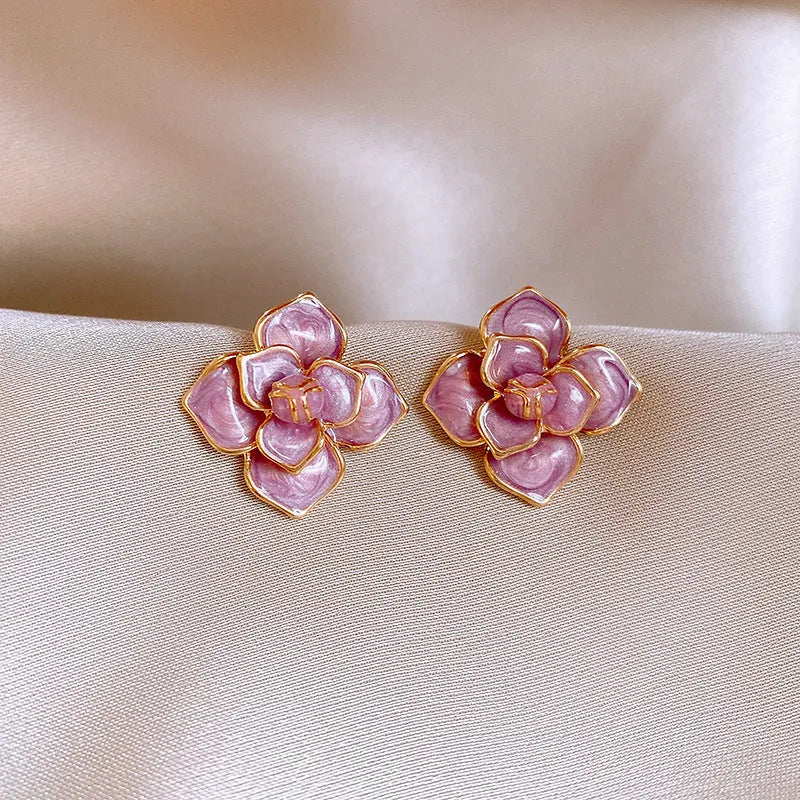 Purple oil-spot glaze floral copper stud earrings with gold-plated silver needle on white background