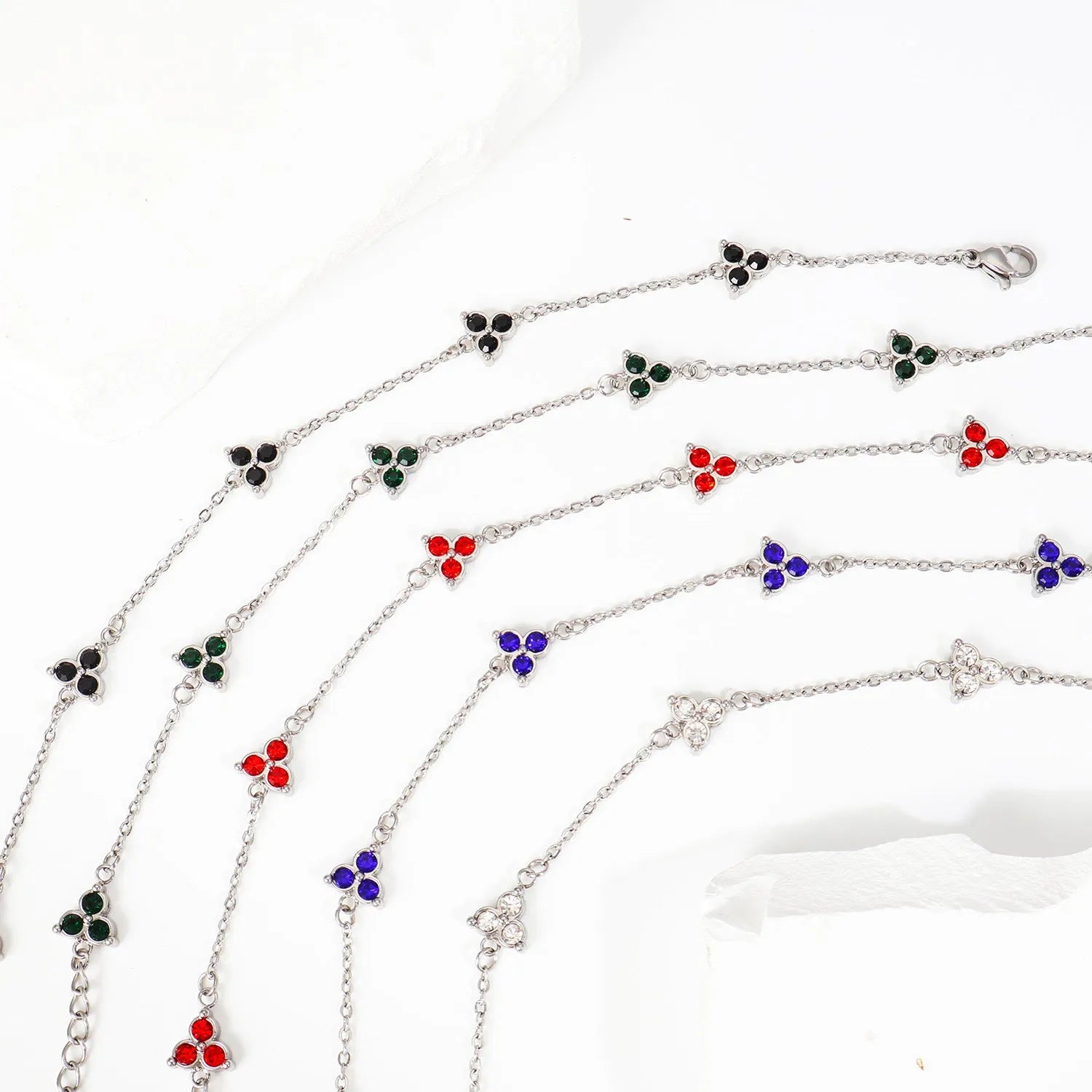 Women's stainless steel geometric triangle bracelet with three diamond stones and adjustable chain