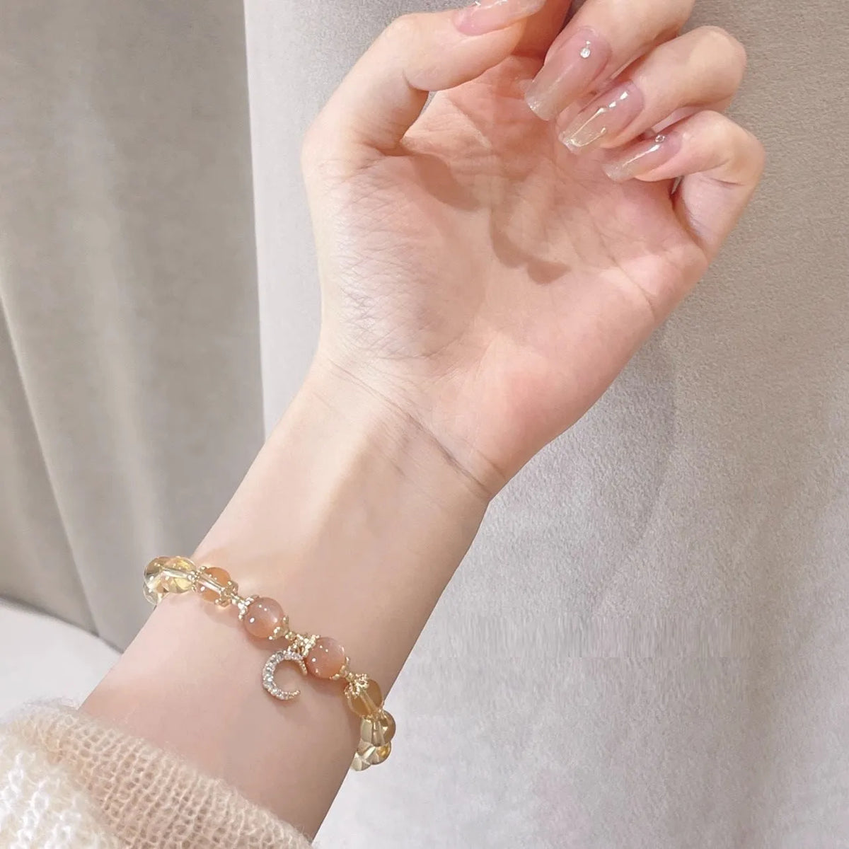Chinese style women's crystal bracelet with 14K gilded moonstone, golden sun stone, and citrine colour diamond-shaped elements