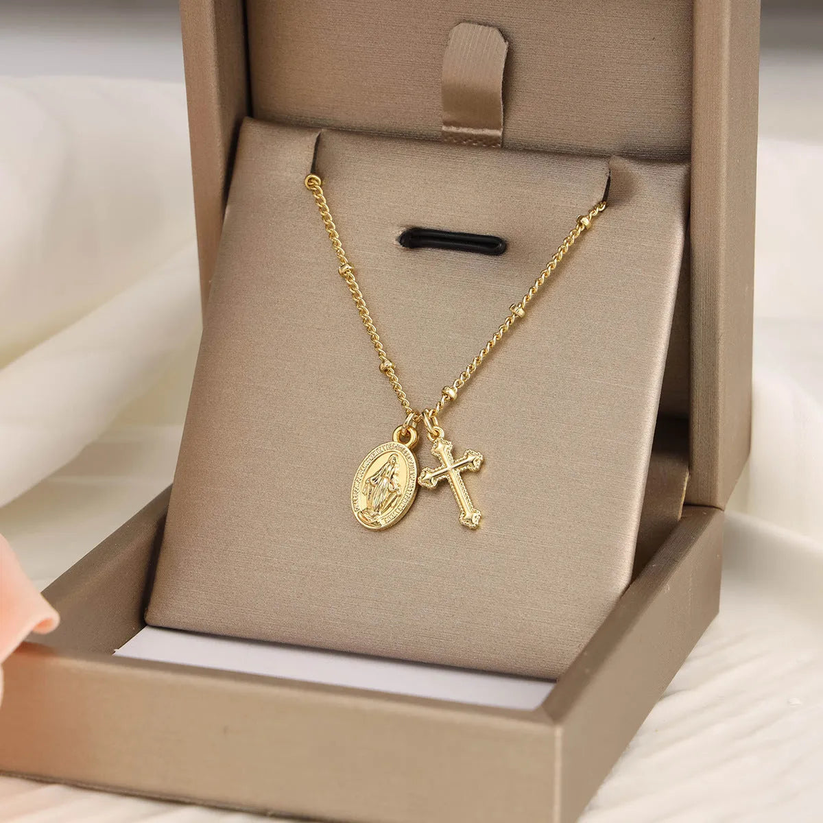 Gold Virgin Mary necklace with geometric cross pendant on copper with 18K plating