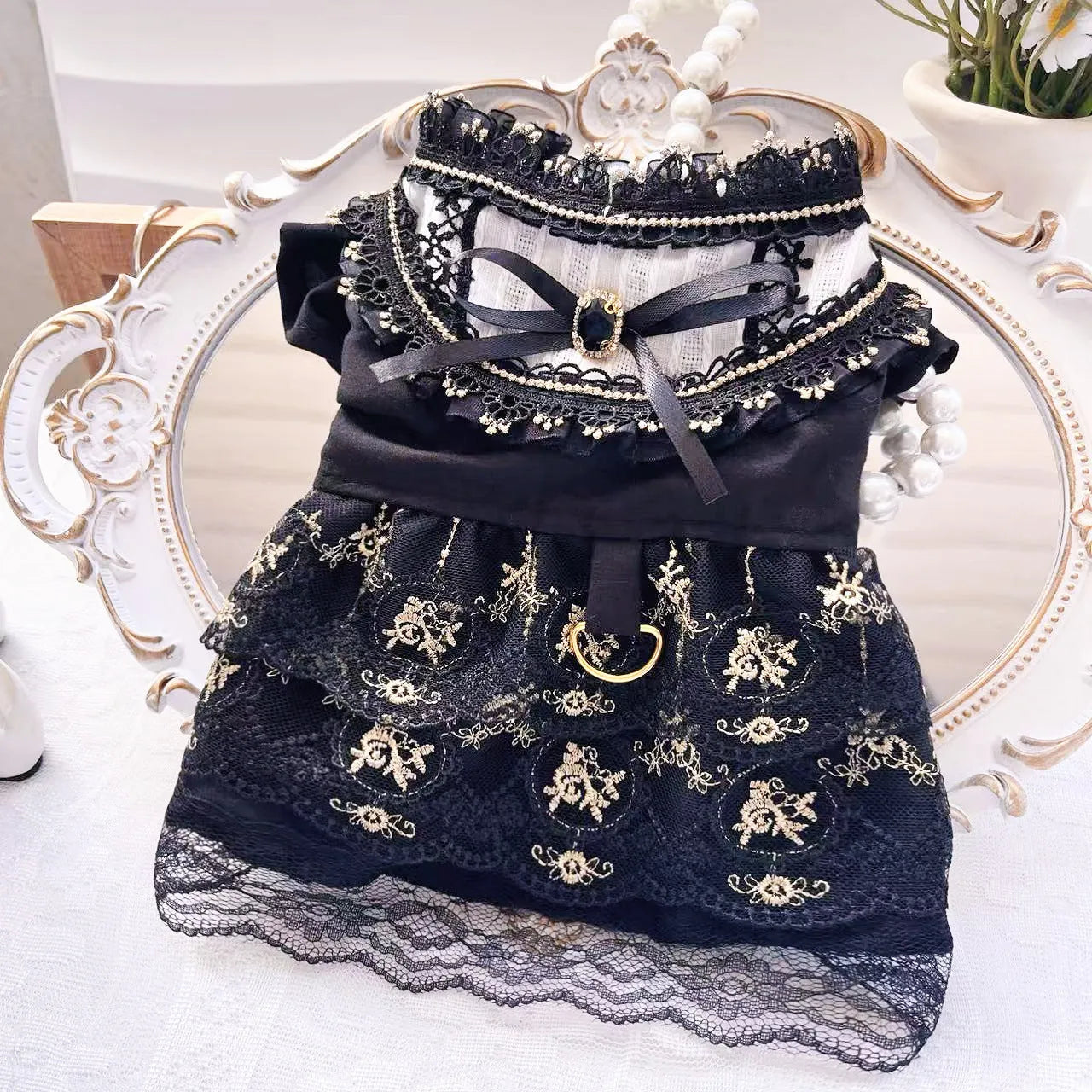 Golden Gothic princess style skirt costume for a small dog or cat on a mannequin.