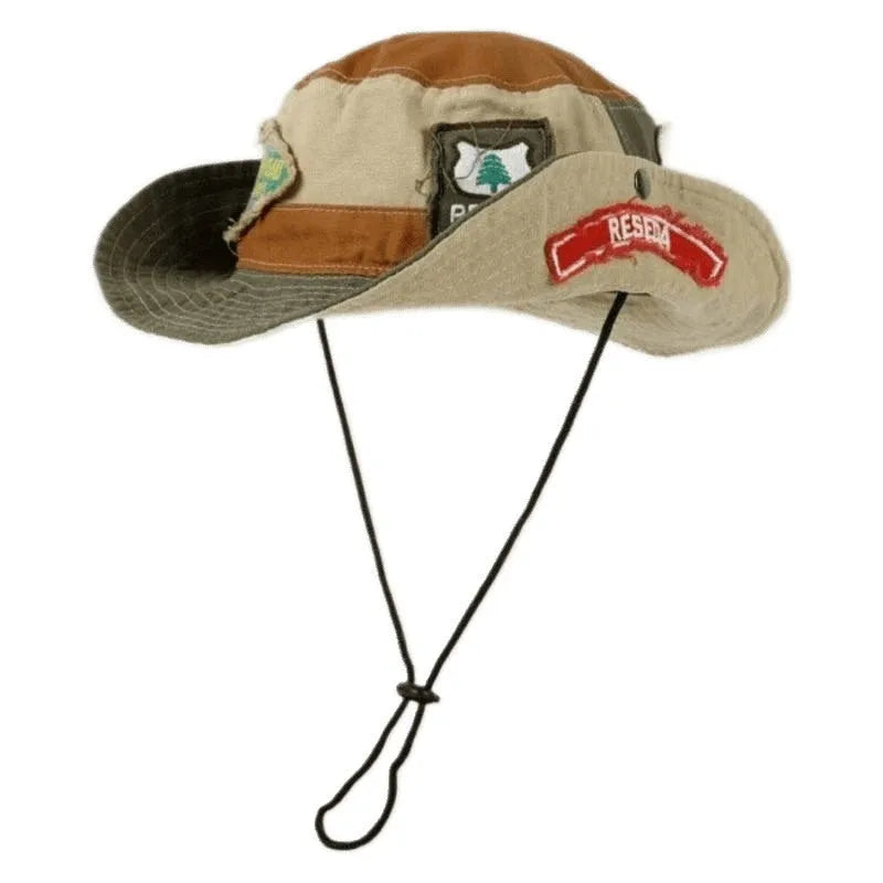 Army green cotton foldable fisherman hat with flat top crown and retro patchwork details.