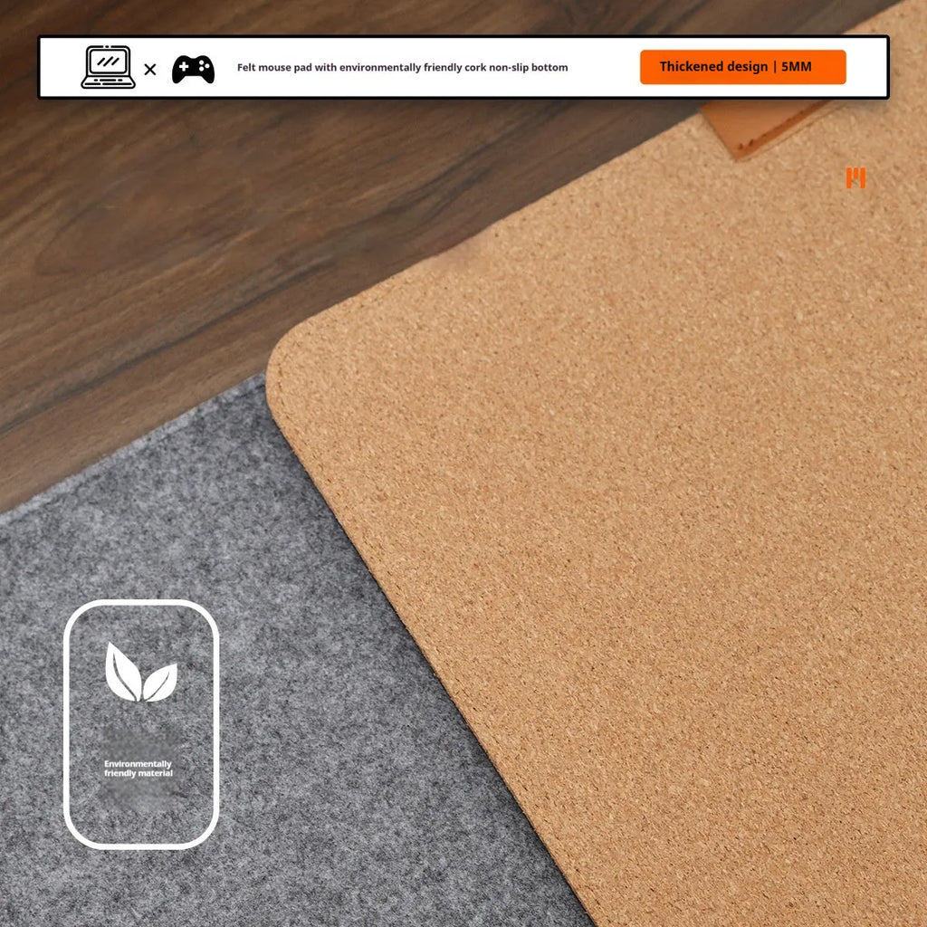 Medium grey felt cork oversized desk mat with Japanese style simple design on a wooden desk.