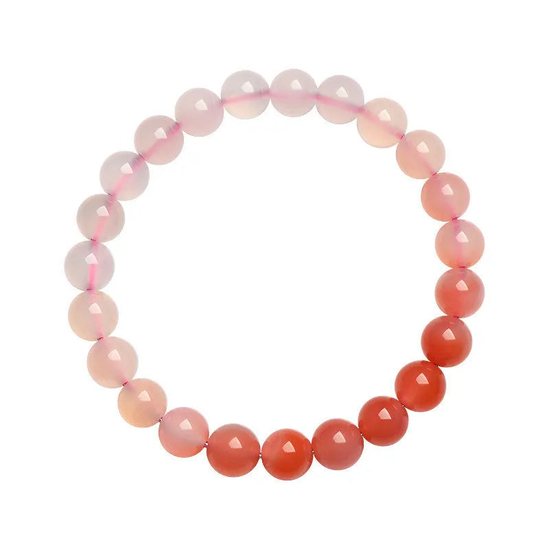Natural gradient Yanyuan agate bracelet in geometric beads on a wrist.
