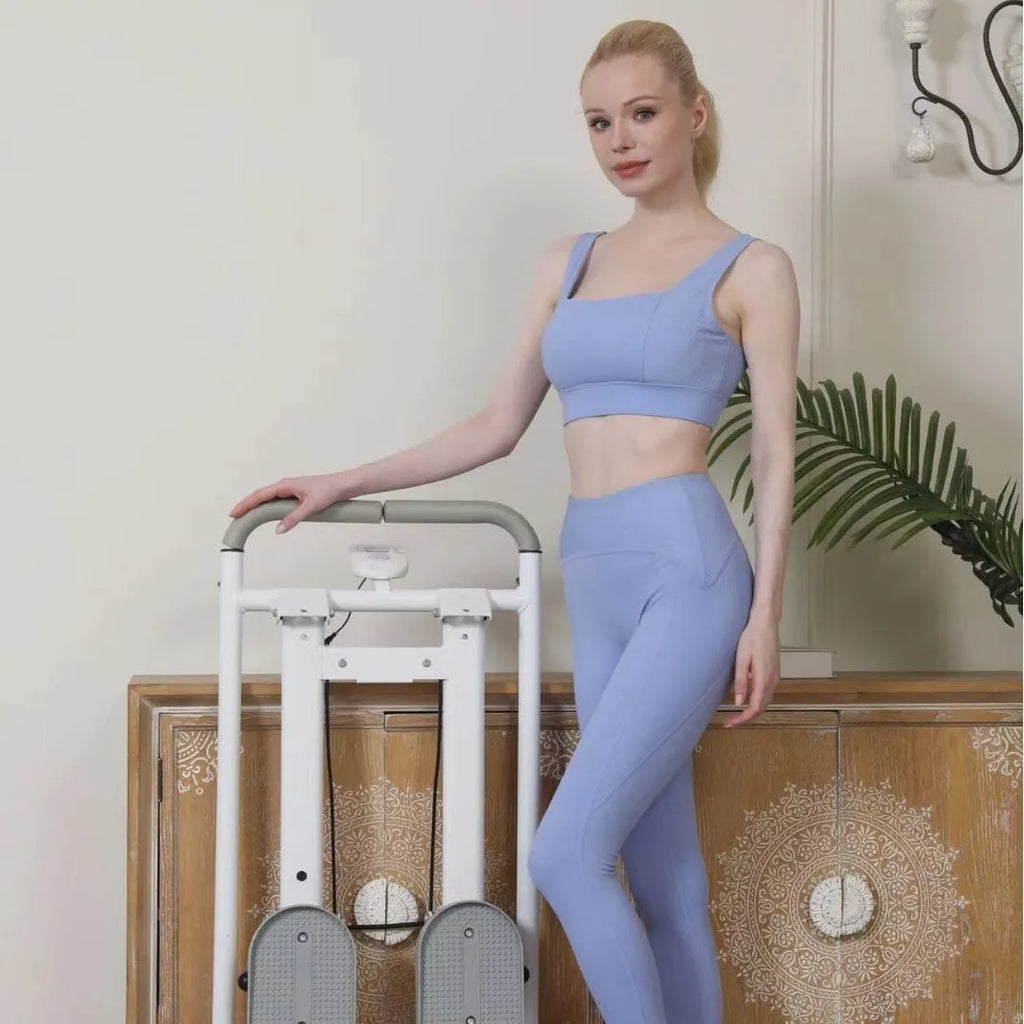 White foldable multi-function treadmill with integrated climbing machine for home fitness