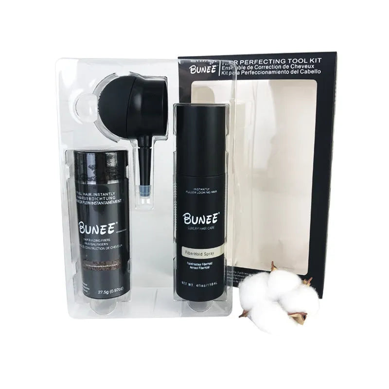Canister of hair thickening fibre powder with nozzle and bottle of styling spray for thinning hair