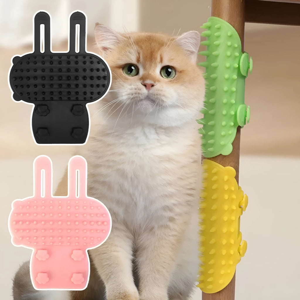 Silicone cat grooming comb with adjustable strap mounted on a table leg, shown in yellow.