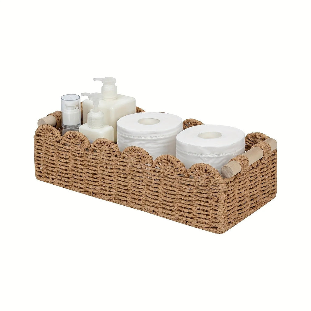 Rectangular woven paper storage basket in khaki colour on a wooden table.
