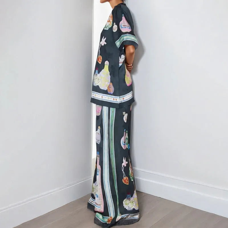 Black women's casual set with cartoon animation print showing cardigan top and matching trousers
