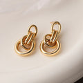 Gold-coloured geometric copper earrings with irregular shape and simple styling for women