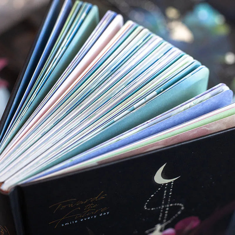 A5 notebook with luminous cover and colour-illustrated pages in four colour options