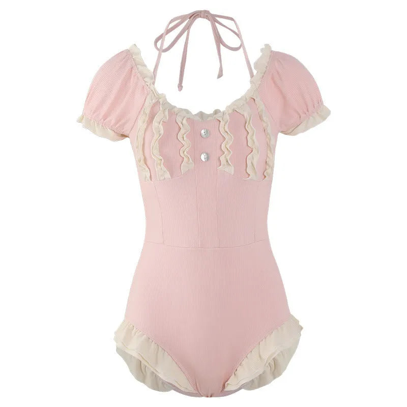 Pink conservative one-piece women's swimsuit made from nylon fabric