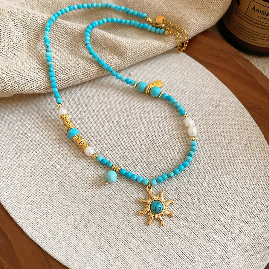 Freshwater pearl necklace with stone sun pendant on clavicle chain