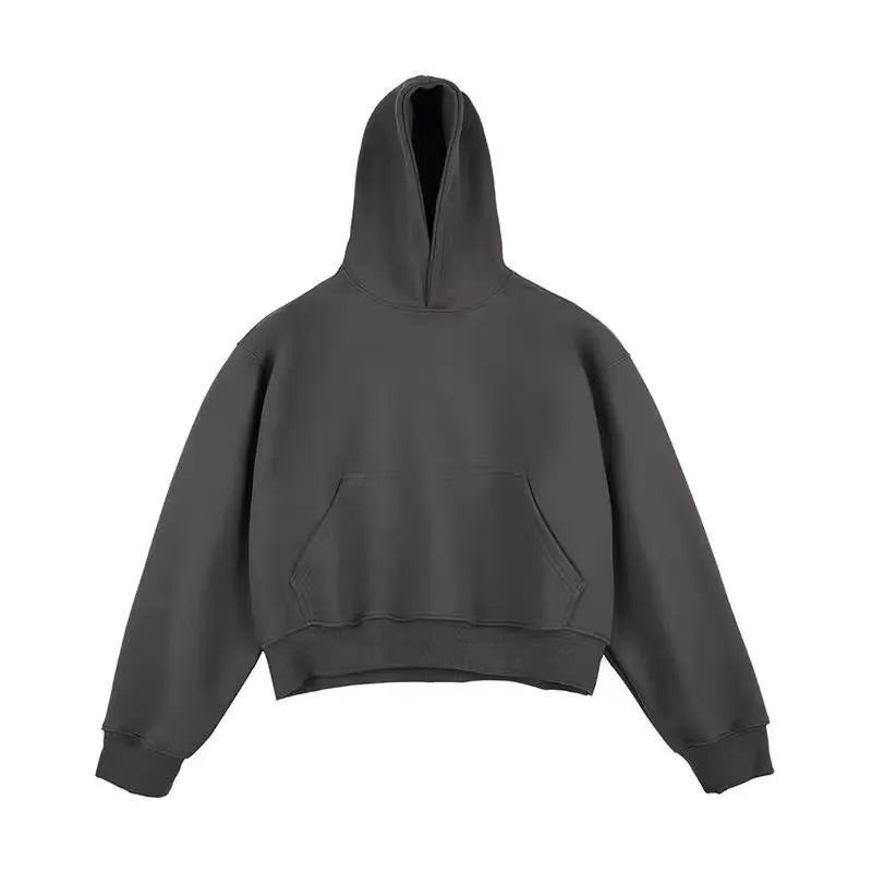 Man wearing a dark grey Chinese cotton composite hooded sweater with the hood removed.