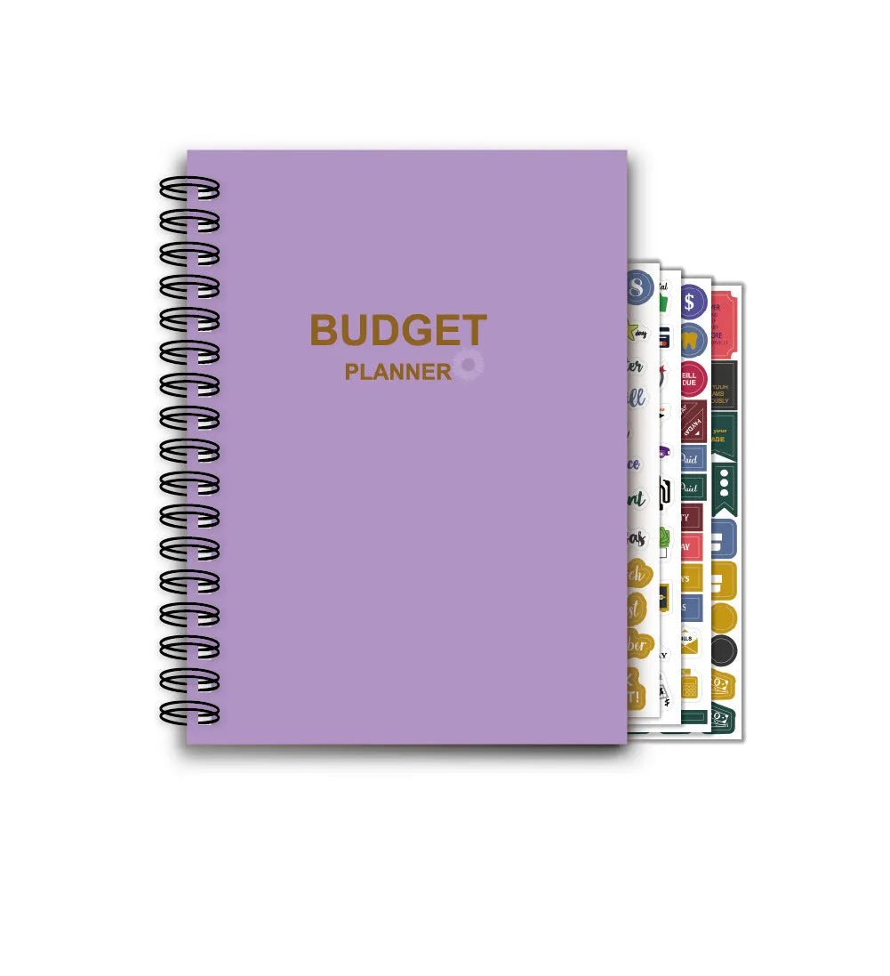 Purple coil-bound financial planning notebook with pen and stickers on a desk.